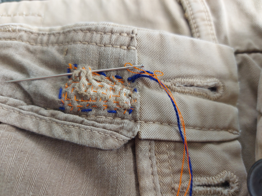 image of a button hole repair